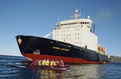 Tourists about to leave the Russian icebreaker Kapitan Dranitsyn on an excursion in inflatable boats. Franz Josef Land, Russia. 2004