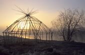 The frame of a traditional Even yurt (tent) at a fishing camp on the Tinga river at sunrise. Khailino, Koryakia, Kamchatka, Siberia, Russia. 1999