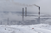 Chimneys from the smelters in the town of Nikel emit sulphur dioxide and other pollutants into the atmosphere. Kola Peninsula. NW Russia. 2005