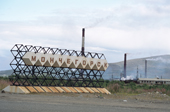 The town sign of Monchegorsk with the chimneys from nickel smelting behind. Kola Peninsula, NW Russia. 2005