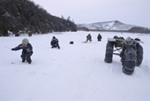 Villagers from Evensk ice fishing for Arctic Char on the Garmanda River. Evensk, Magadan Region, E. Siberia, Russia. 2006