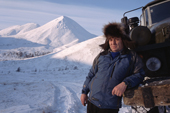 Truck driver, Vassily Nesmelov, takes a break on a winter road in the Kolyma Mountain Range. Magadan Region, E. Siberia, Russia. 2006