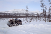 An Ural truck carrying supplies on a winter road in Northern Evensk, Magadan Region, Eastern Siberia, Russia. 2006