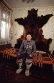 Aleksey Ulrika, an Even man from Gizhiga sitting in front of a bear skin. Northern Evensk, Magadan Region, E.Siberia, Russia. 2006