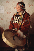 Irina, a Koryak woman from Evensk, playing a traditional drum. Magadan Region, Eastern Siberia, Russia. 2006