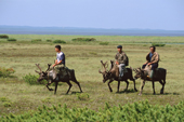 Uilta (Orok) herders riding their reindeer at their summer pastures in Piltun Bay. Sakhalin Island, Russian Far East. 2006