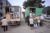 Shoppers wait to buy fresh vegetables from a truck in a market in Yuzhno Sakhalinsk. Sakhalin Island, Russian Far East. 2006