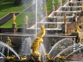 Gilded statues, including Samson rending open the jaws of the lion, and the Great Cascade at Peterhof Palace. Near St. Petersburg, Russia. 2010