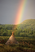 A rainbow over a reindeer herders' tent in Todzhu. Republic of Tuva, Siberia, Russia. 1998