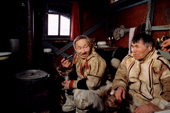 Two Nganasan men, Saibore Momde & Mereme Moibo (right) relaxing in a hut at a camp on the Kheta River. Taymyr, Northern Siberia, Russia. 2004