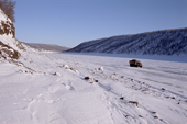A truck travelling along a winter road on the frozen Kotuy River. Taymyr, Northern Siberia, Russia. 2004