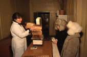 Lena Potapova & hers sister Varya buying bread at the bakery in Verkhoyansk. Yakutia, Siberia, Russia. 1999