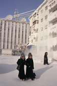 Yakut women warmly dressed in furs walk on a street in the centre of Yakutsk during the winter. Yakutsk, Siberia. 2001