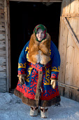 Feodosia Moldanova, a Khanty grandmother, dressed in her traditional reindeer skin winter clothes, at a homestead near Numto. Khanty Mansiysk, Northwest Siberia, Russia