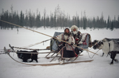 Tania Serotetto, a Nenets woman, and her daughter Christina, travelling on a traditional reindeer sled during the Spring migration. Yamal. Siberia. Russia. 1993