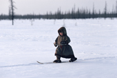 Ivan Vylka, a Nenets boy, skiing. Nenets children learn to ski almost as soon as they can walk. Yamal. Siberia. Russia. 1993