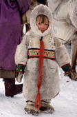 A young Komi girl dressed in traditional reindeer skin clothing. Yamal, Western Siberia, Russia.
