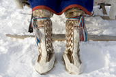A Forest Nenets man wearing traditional reindeer skin winter boots. Purovsky Region, Yamal. Western Siberia, Russia