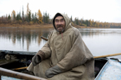 Vassilly Longortov, an elderly Khanty man, out fishing in his boat on the Synya River. Yamal, Western Siberia, Russia
