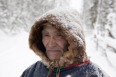 Ivan Agichev, an elderly Selkup man, out in the forest in the winter. Krasnoselkup, Yamal, Western Siberia, Russia. (2012)