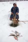 Ivan Agichev, a Selkup elder, checking his fishing net set under the ice of the Pechalka River in Krasnoselkup. Yamal, Western Siberia, Russia. (2012)