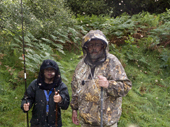 Man and youth prepare to go Salmon fishing but wear protective clothing against the Midges. Scotland