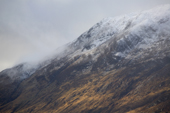 Snow flurries over the mountains by Loch Affric. Scotland