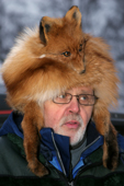 Man in a fox skin hat, complete with mask at the Sami Winter Market. Jokkmokk. Sweden. Size to A4