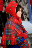 Sami girl in traditional hat and shawl. Jokkmokk Winter Market, Sweden. Size to A4