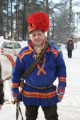 Sami reindeer herder in traditional clothing with his lasso. Jokkmokk. Sweden. Size to A4