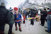 Sami reindeer herder gives press interview at the Jokkmokk Winter Market. Sweden. Size to A4