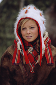 Portrait of pretty Sami girl in a traditional hat and peske at the Jokkmokk Winter Market. Sweden
