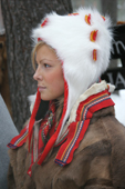 Portrait of pretty Sami girl in a traditional hat and peske at the Jokkmokk Winter Market. Sweden. Size to A4