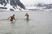 Mite and Adrian go for a freezing midsummer swim in Beverleysundet. Svalbard
