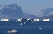 Huge icebergs by Gurreholm with tour ship Professor Multanovskiy in northern Scoresbysund Fjord, East Greenland  2003.