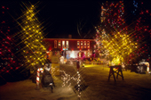 A house & garden elaborately decorated with Christmas lights in Winnipeg, Manitoba Canada.